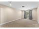 Spacious bedroom with a window and grey curtains at 4190 Pickering Dr, Hickory, NC 28602