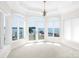 Bright sunroom with stunning lake views and access to patio at 3446 Governors Island Dr, Denver, NC 28037