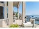 Relaxing covered patio overlooking lake with seating area and beautiful water views at 3446 Governors Island Dr, Denver, NC 28037