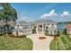 Lakefront home with a large driveway and manicured lawn at 3446 Governors Island Dr, Denver, NC 28037