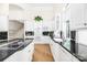 White kitchen with granite countertops and high-end appliances at 3446 Governors Island Dr, Denver, NC 28037