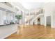 Spacious living room with hardwood floors and a view of the staircase and wet bar at 3446 Governors Island Dr, Denver, NC 28037