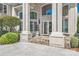 Elegant entryway with columns and lush landscaping at 3446 Governors Island Dr, Denver, NC 28037