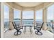 Private balcony with lake view and seating area at 3446 Governors Island Dr, Denver, NC 28037