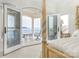 Main bedroom with private balcony and lake view at 3446 Governors Island Dr, Denver, NC 28037