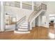 Elegant curved staircase with wrought iron at 3446 Governors Island Dr, Denver, NC 28037