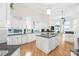 Island kitchen with granite countertops and white cabinets at 3446 Governors Island Dr, Denver, NC 28037