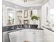 Breakfast bar with granite countertop and white cabinetry at 3446 Governors Island Dr, Denver, NC 28037