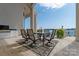 Outdoor kitchen with built-in grill and lake views at 3446 Governors Island Dr, Denver, NC 28037