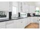 Kitchen with granite counters, white cabinets, and a lake view at 3446 Governors Island Dr, Denver, NC 28037