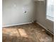 Laundry area with tile flooring and built-in shelving at 105 S Inman Ave, Bessemer City, NC 28016