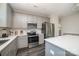 Modern kitchen with gray cabinets, quartz countertops, and stainless steel appliances at 2005 Germany Dr, Dallas, NC 28034