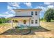 Two-story house with covered patio and playset at 2005 Germany Dr, Dallas, NC 28034