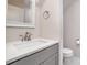 Modern bathroom with gray vanity, white countertop, and updated fixtures at 2005 Germany Dr, Dallas, NC 28034