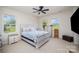 Spacious bedroom with a ceiling fan, large windows, and ample natural light at 2005 Germany Dr, Dallas, NC 28034