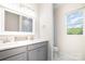 Modern bathroom with double vanity and marble tile at 2005 Germany Dr, Dallas, NC 28034