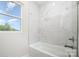 Clean bathroom with bathtub and marble tile shower surround at 2005 Germany Dr, Dallas, NC 28034