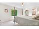 Bedroom with a four-poster bed and large window at 4299 Randleman Rd, Iron Station, NC 28080