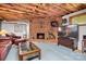 Spacious basement living area with fireplace and large TV at 4299 Randleman Rd, Iron Station, NC 28080