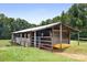 Rustic wooden barn with metal roof, ideal for storage or animals at 4299 Randleman Rd, Iron Station, NC 28080