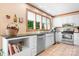 Kitchen features white cabinets, granite countertops, and stainless steel appliances at 4299 Randleman Rd, Iron Station, NC 28080
