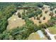 Aerial view showing home, outbuildings, and large property at 4299 Randleman Rd, Iron Station, NC 28080