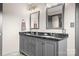 Bathroom with double vanity and dark countertop at 4299 Randleman Rd, Iron Station, NC 28080