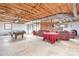 Finished basement with pool table, fireplace, and seating area at 4299 Randleman Rd, Iron Station, NC 28080