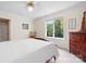 Bedroom with large window, dresser, and ensuite bathroom at 4299 Randleman Rd, Iron Station, NC 28080