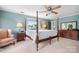 Main bedroom with a four-poster bed and ensuite at 4299 Randleman Rd, Iron Station, NC 28080