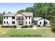 Two-story whitewashed house with black trim at 4299 Randleman Rd, Iron Station, NC 28080