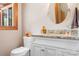 Updated bathroom with granite vanity and large mirror at 4299 Randleman Rd, Iron Station, NC 28080