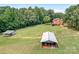Aerial view of house, detached garage, and large yard at 4299 Randleman Rd, Iron Station, NC 28080