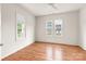 Bright bedroom with hardwood floors and ceiling fan at 1107 E 36Th St, Charlotte, NC 28205