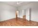 Bedroom with hardwood floors, access to closet and another room at 1107 E 36Th St, Charlotte, NC 28205