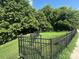 Fenced dog park with grassy area and trees at 2220 Camalier Ln, Charlotte, NC 28273