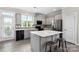 Modern kitchen featuring island, stainless steel appliances, and gray cabinets at 2220 Camalier Ln, Charlotte, NC 28273