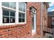 Brick townhome exterior with balcony and door at 2220 Camalier Ln, Charlotte, NC 28273