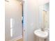 Small bathroom with pedestal sink and mirror at 1530 Levy Way, Charlotte, NC 28205