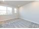 Spacious bedroom with grey carpet and large windows at 1530 Levy Way, Charlotte, NC 28205