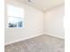 Bright bedroom with grey carpet and a window at 1530 Levy Way, Charlotte, NC 28205