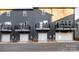 Rear view of townhouses with attached garages at 1530 Levy Way, Charlotte, NC 28205