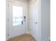 White front door with glass panel and keyless entry at 1530 Levy Way, Charlotte, NC 28205