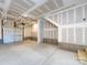 Unfinished garage with open space and stairs at 1530 Levy Way, Charlotte, NC 28205