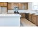 Modern kitchen with island, stainless steel appliances, and light wood cabinets at 1530 Levy Way, Charlotte, NC 28205