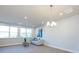 Bright living room with large windows, hardwood floors, and a comfy sofa at 1530 Levy Way, Charlotte, NC 28205