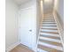 Modern staircase with light wood treads and white risers at 1530 Levy Way, Charlotte, NC 28205