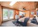 Spacious bedroom with wood walls, and access to a deck at 115 Pier Point Dr, Stony Point, NC 28678