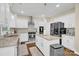 Updated kitchen with island, stainless steel appliances and white cabinets at 8534 Headford Rd, Charlotte, NC 28277