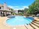 Inviting swimming pool with brick steps, a pergola, and hot tub at 8534 Headford Rd, Charlotte, NC 28277